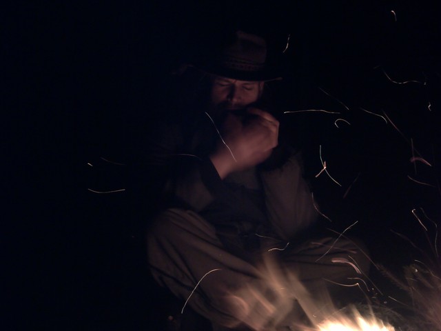 late evening, playing mouth harp